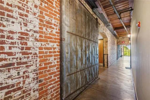 a living room with furniture wooden floor and a fireplace