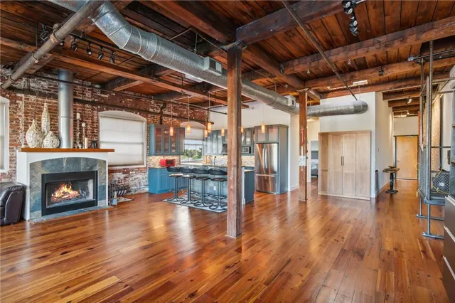 a kitchen with granite countertop a stove and white cabinets
