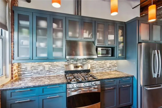 a bathroom with a shower and closet