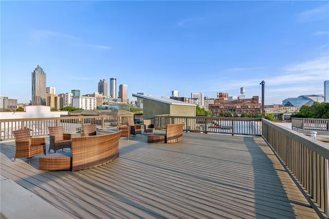 a living room with furniture stove and wooden floor