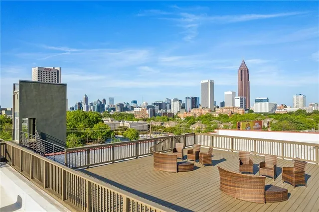 a view of a balcony with two chairs and a table