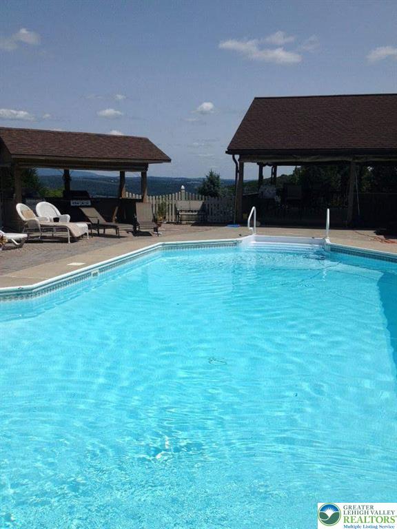 3511 Timber Lane Slatington, PA 18080 - Photo 11 of 27 a swimming pool with outdoor seating and yard