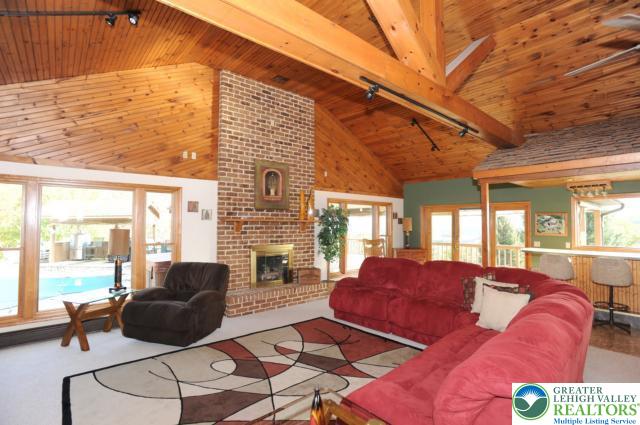 3511 Timber Lane Slatington, PA 18080 - Photo 13 of 27 a living room with furniture a flat screen tv and a large window