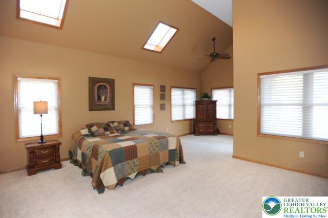 3511 Timber Lane Slatington, PA 18080 - Photo 16 of 27 a spacious bedroom with a bed and a couch