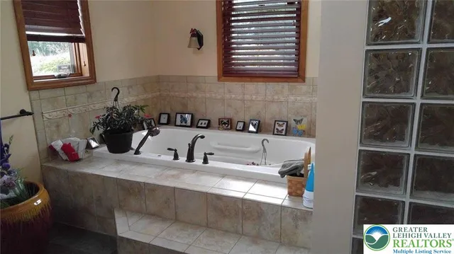 a bathroom with a sink and a window