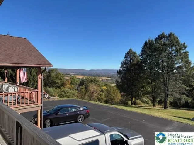 a view of a car parked in front of a house