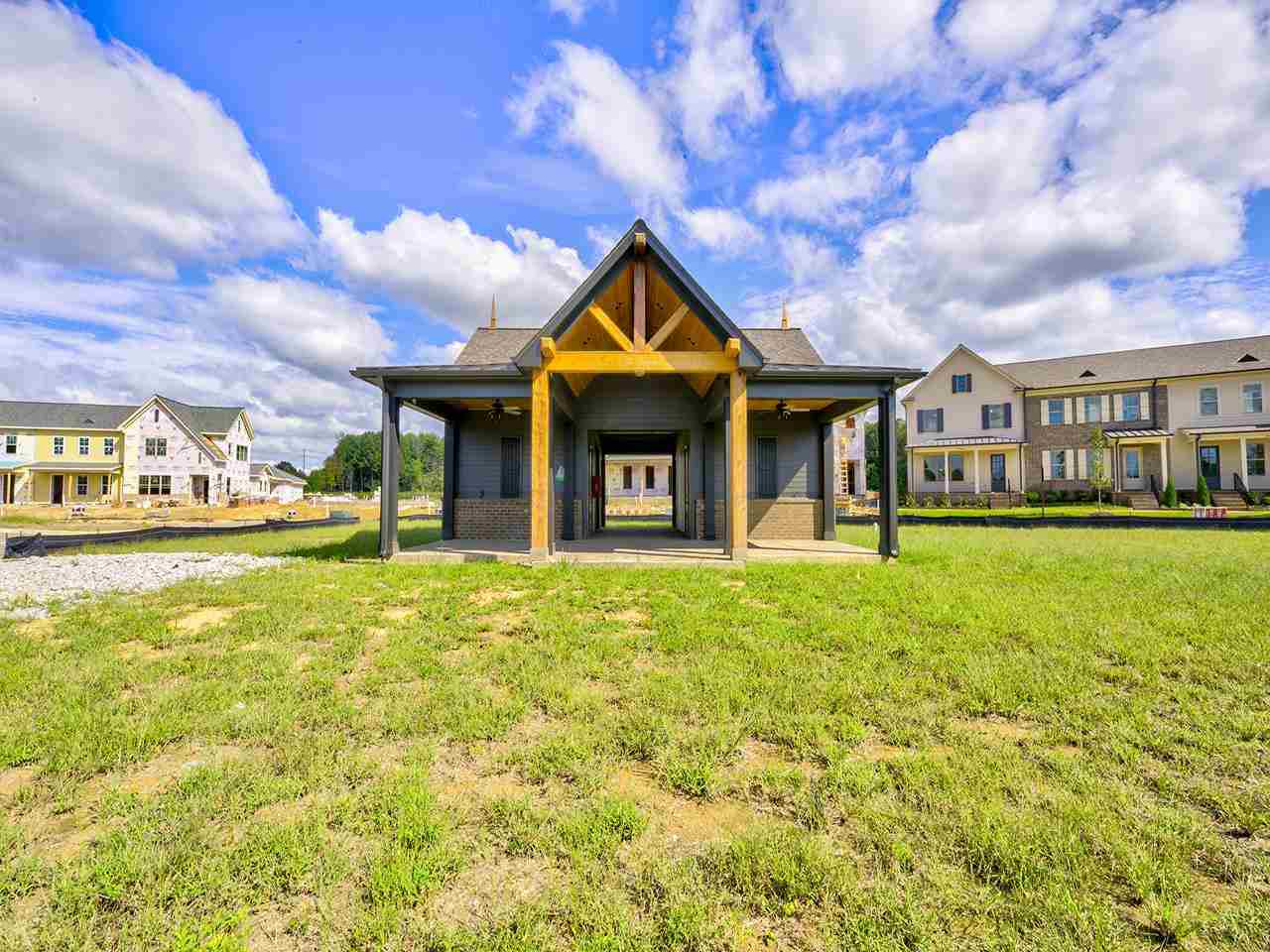 558 Ashburn Drive Collierville, TN 38017 - Photo 17 of 21 a view of a big house with a big yard and large trees