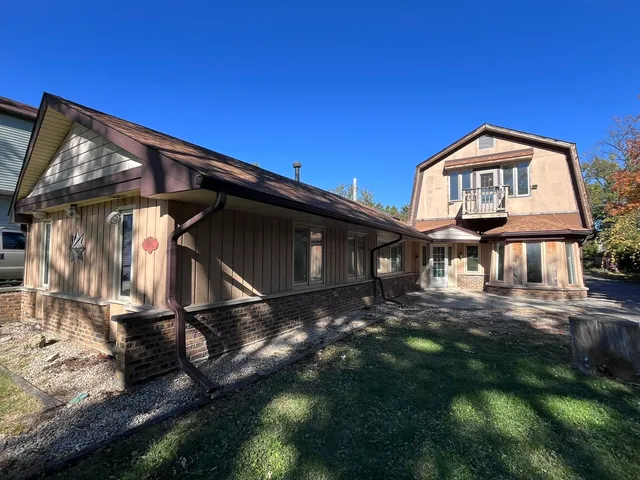 a house with trees in the background
