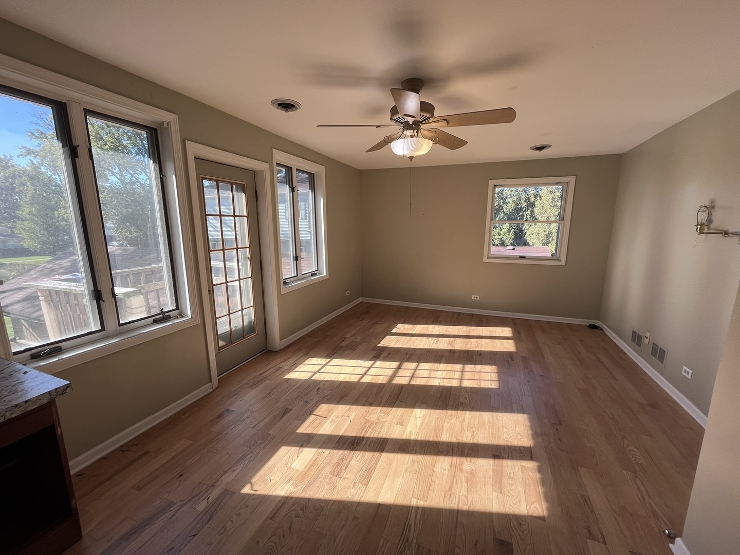 1700 Forest Avenue Des Plaines, IL 60018 - Photo 15 of 20 a view of an empty room with wooden floor and a window