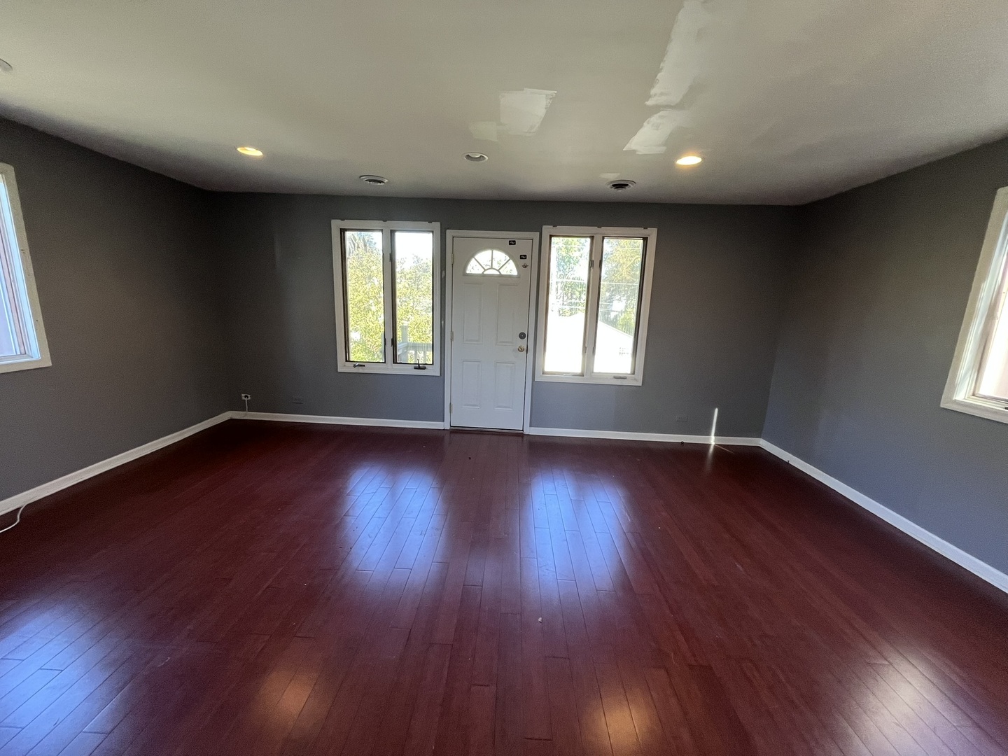 1700 Forest Avenue Des Plaines, IL 60018 - Photo 16 of 20 a view of an empty room with wooden floor and a window