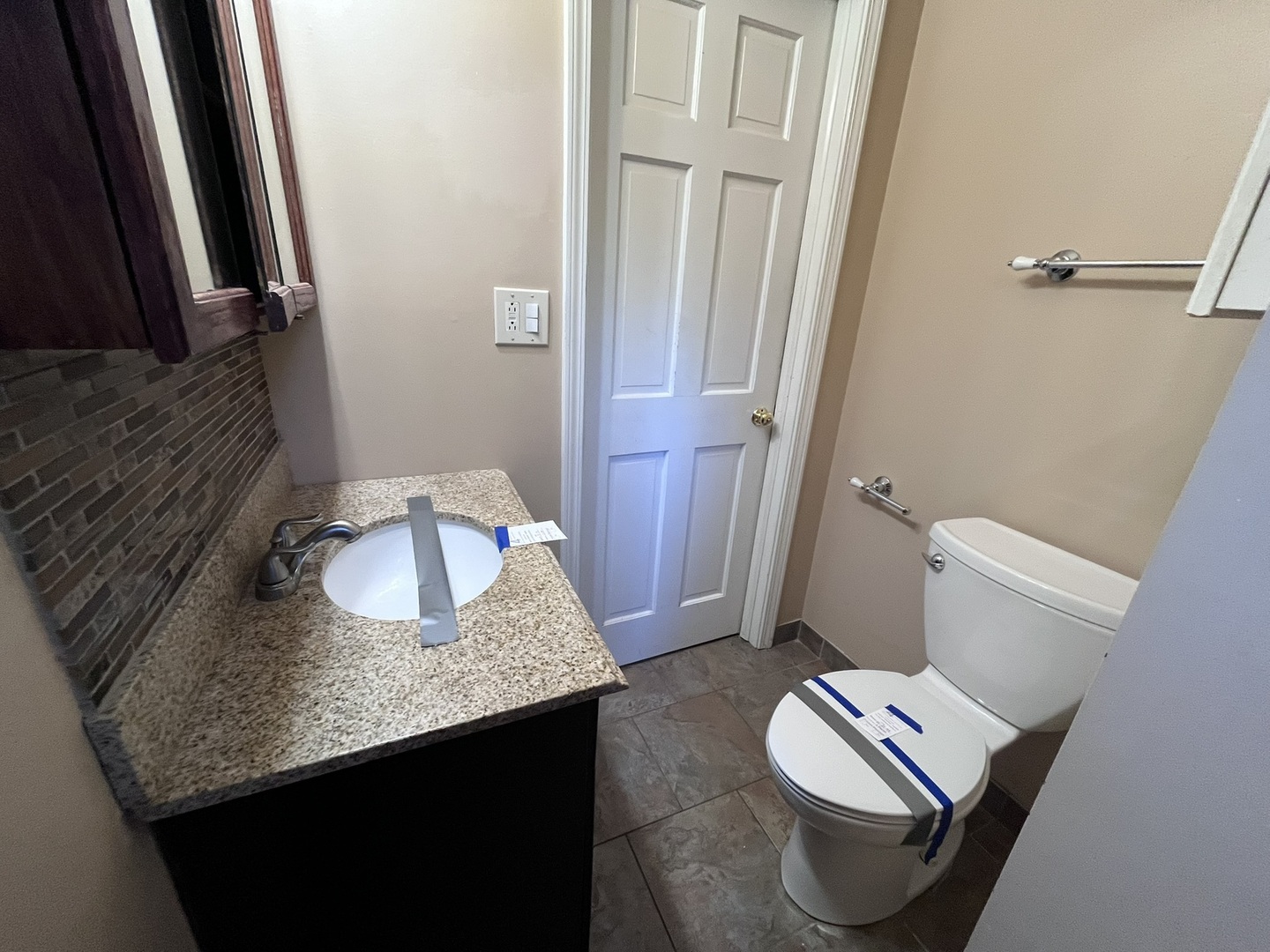 1700 Forest Avenue Des Plaines, IL 60018 - Photo 17 of 20 a bathroom with a granite countertop sink and a mirror