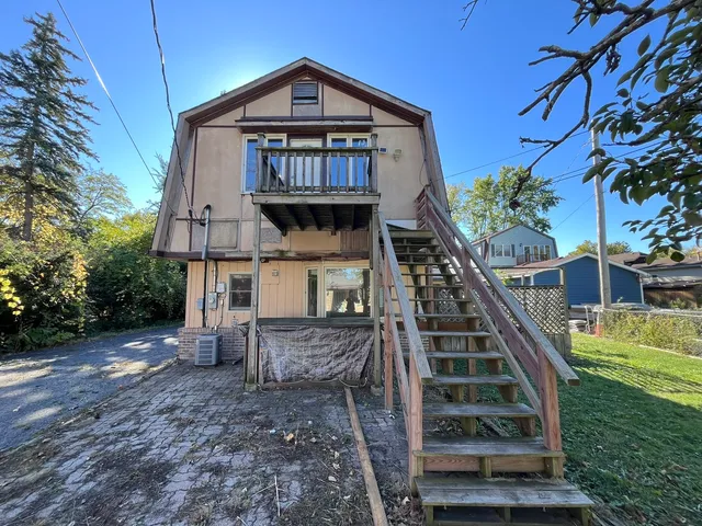 a view of a house with a small yard