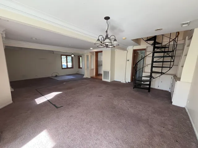 a view of a livingroom with a staircase