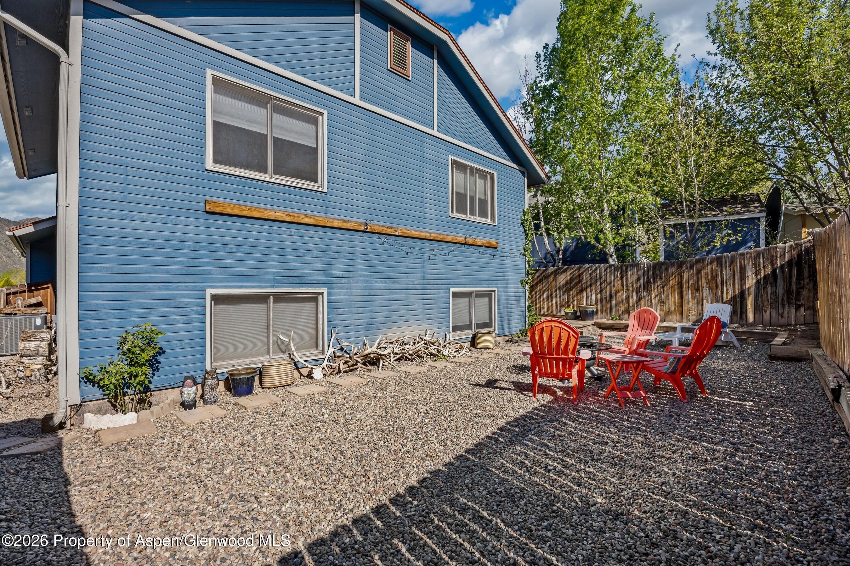 212 Safflower Court New Castle, CO 81647 - Photo 24 of 27 a backyard of a house with seating space