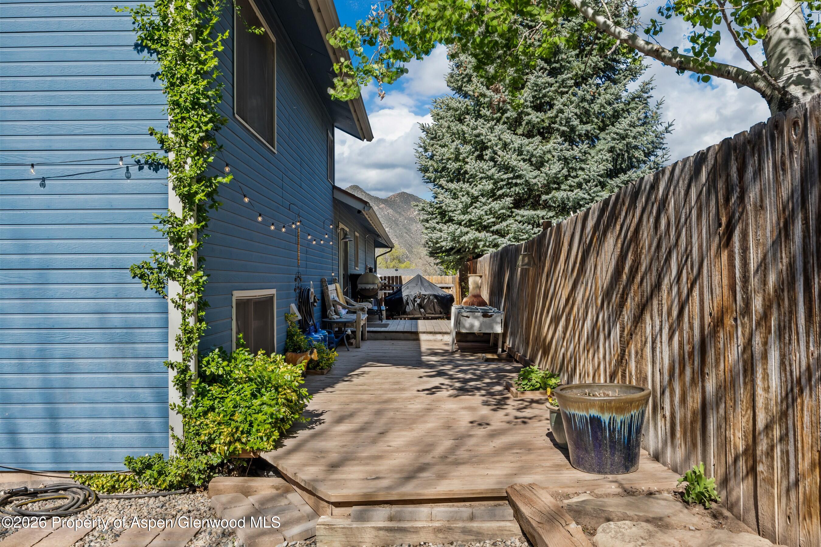 212 Safflower Court New Castle, CO 81647 - Photo 26 of 27 a view of a backyard with sitting area and furniture