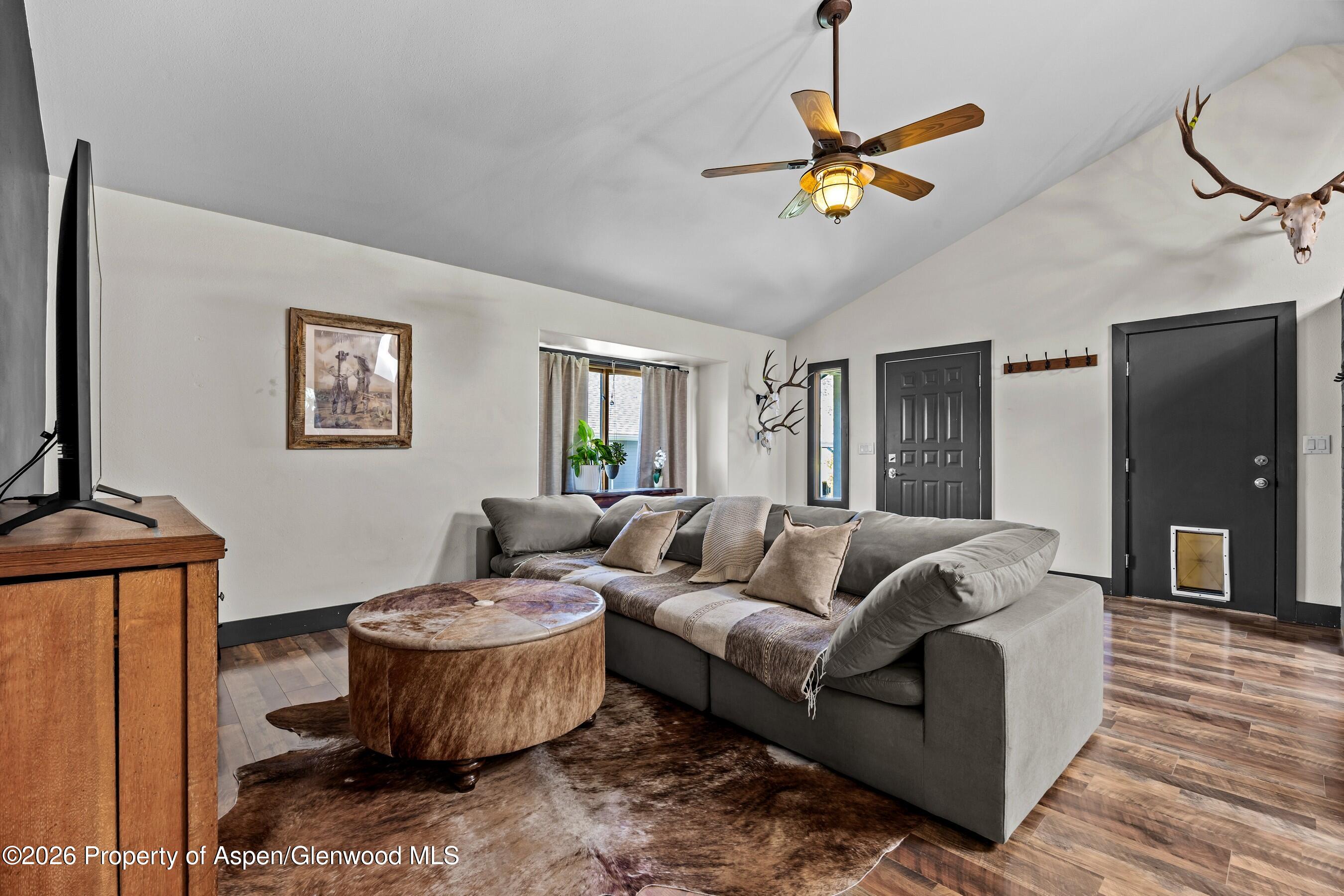 212 Safflower Court New Castle, CO 81647 - Photo 5 of 27 a living room with furniture and a wooden floor
