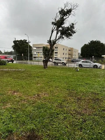 a view of a water fountain and a big yard