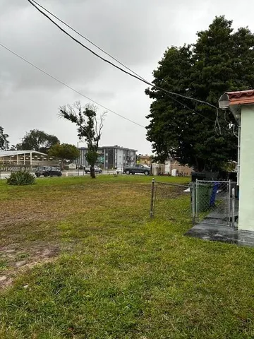 a view of a lake with a yard