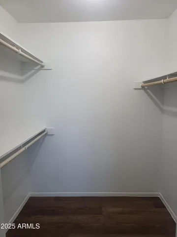 a view of an empty walk in closet
