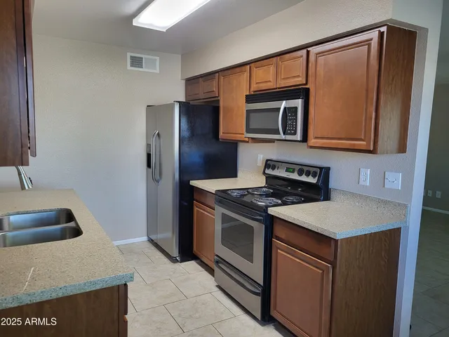 a kitchen with a stove and a microwave