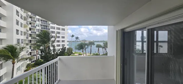 a view of balcony with furniture
