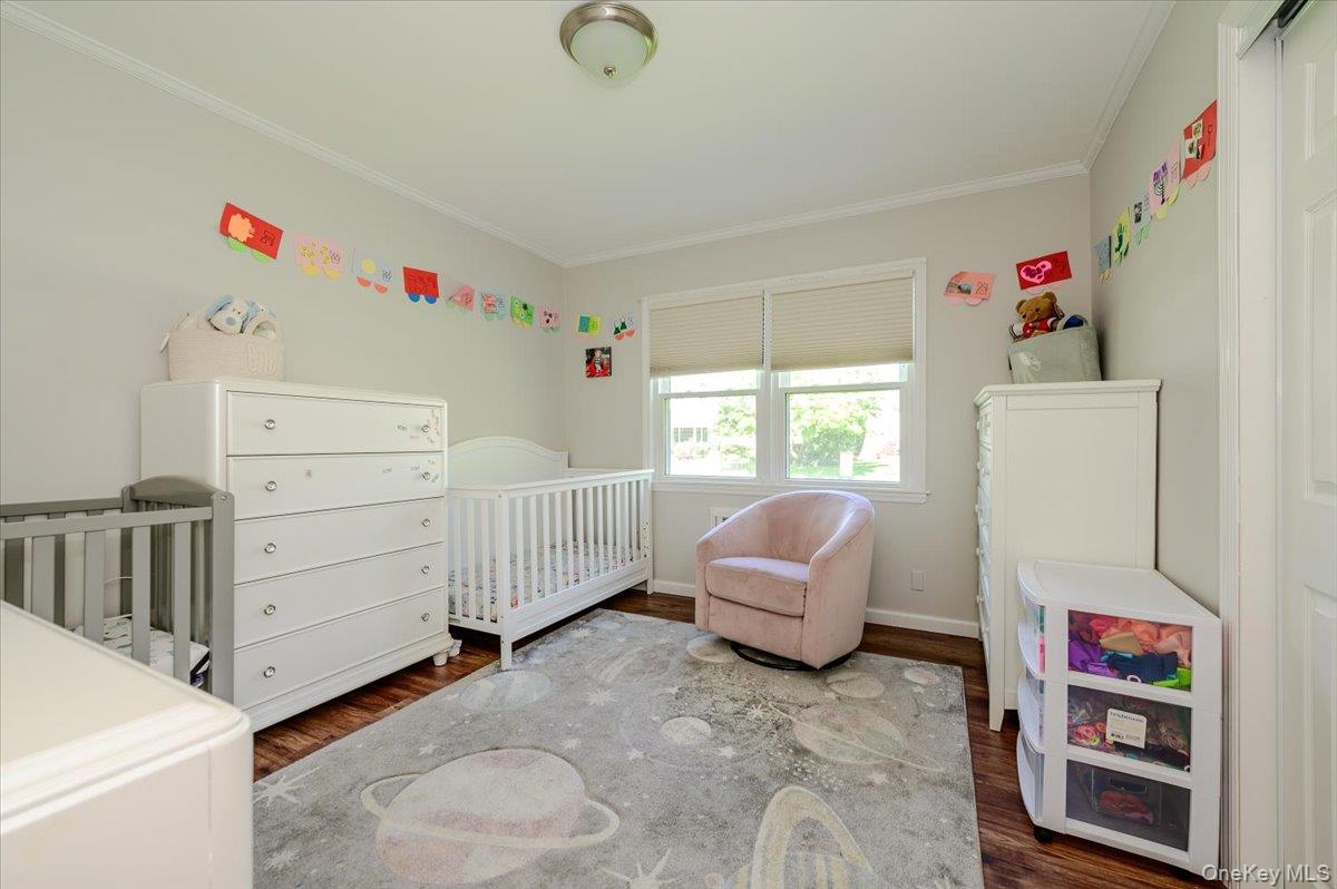 534 Allen Road Woodmere, NY 11598 - Photo 17 of 35 a bedroom with furniture and a window