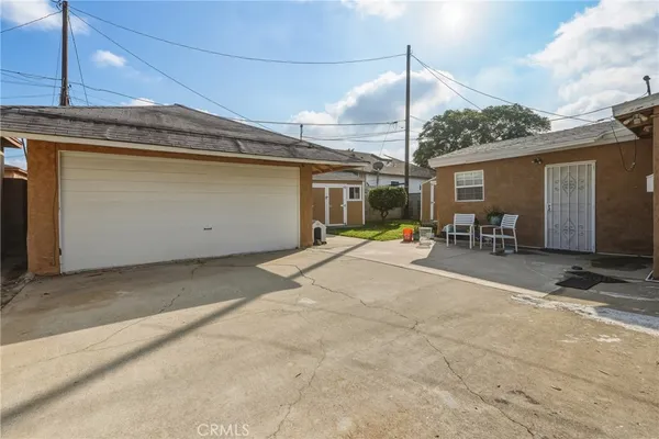 a view of a backyard with a patio