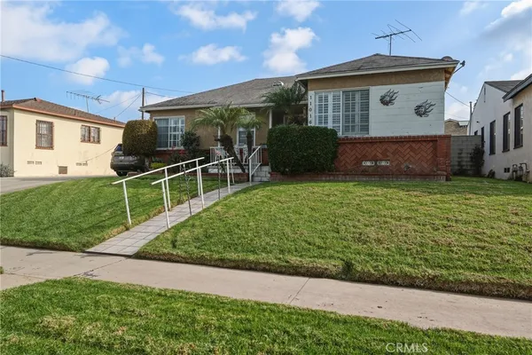 a front view of a house with yard