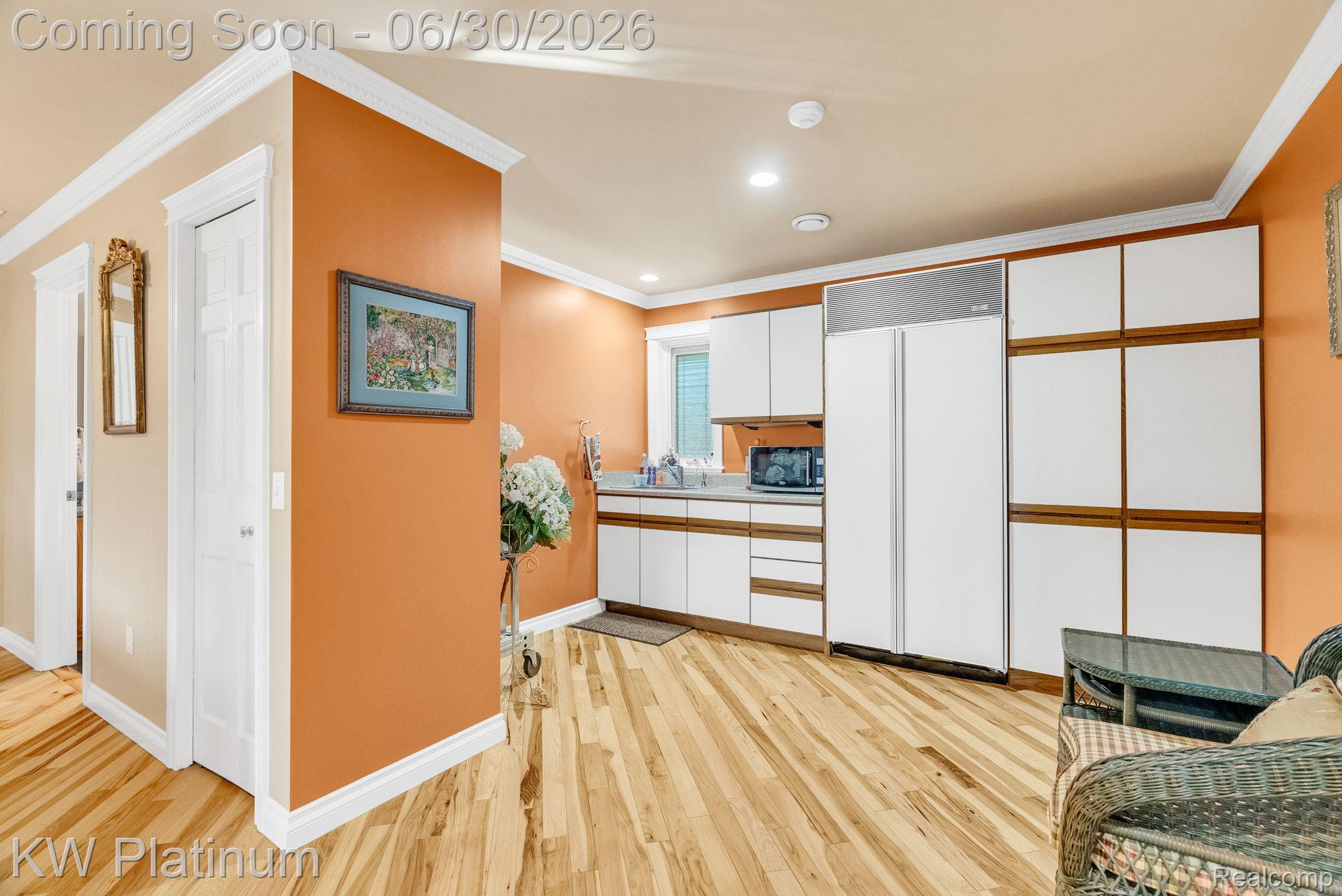 2235 South Lake Shore Road Harbor Beach, MI 48441 - Photo 29 of 99 Kitchenette featuring light wood-finish flooring, white cabinetry, and a full-size refrigerator