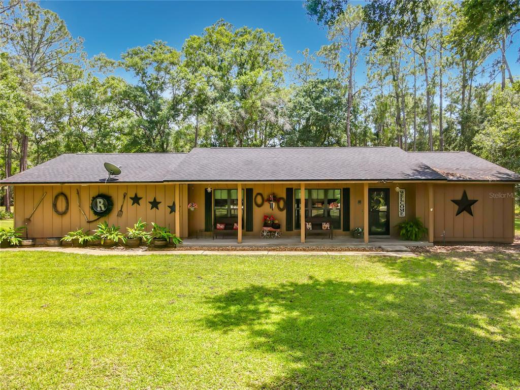 1395 Maytown Road Osteen, FL 32764 - Photo 4 of 65 a front view of a building with a yard
