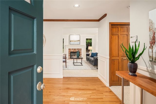 a view of living room with furniture and wooden floor
