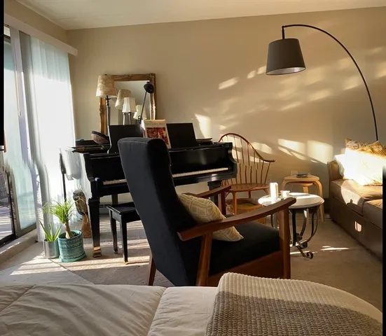 a dining room with furniture and wooden floor