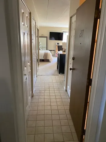 a view of a hallway with a couch