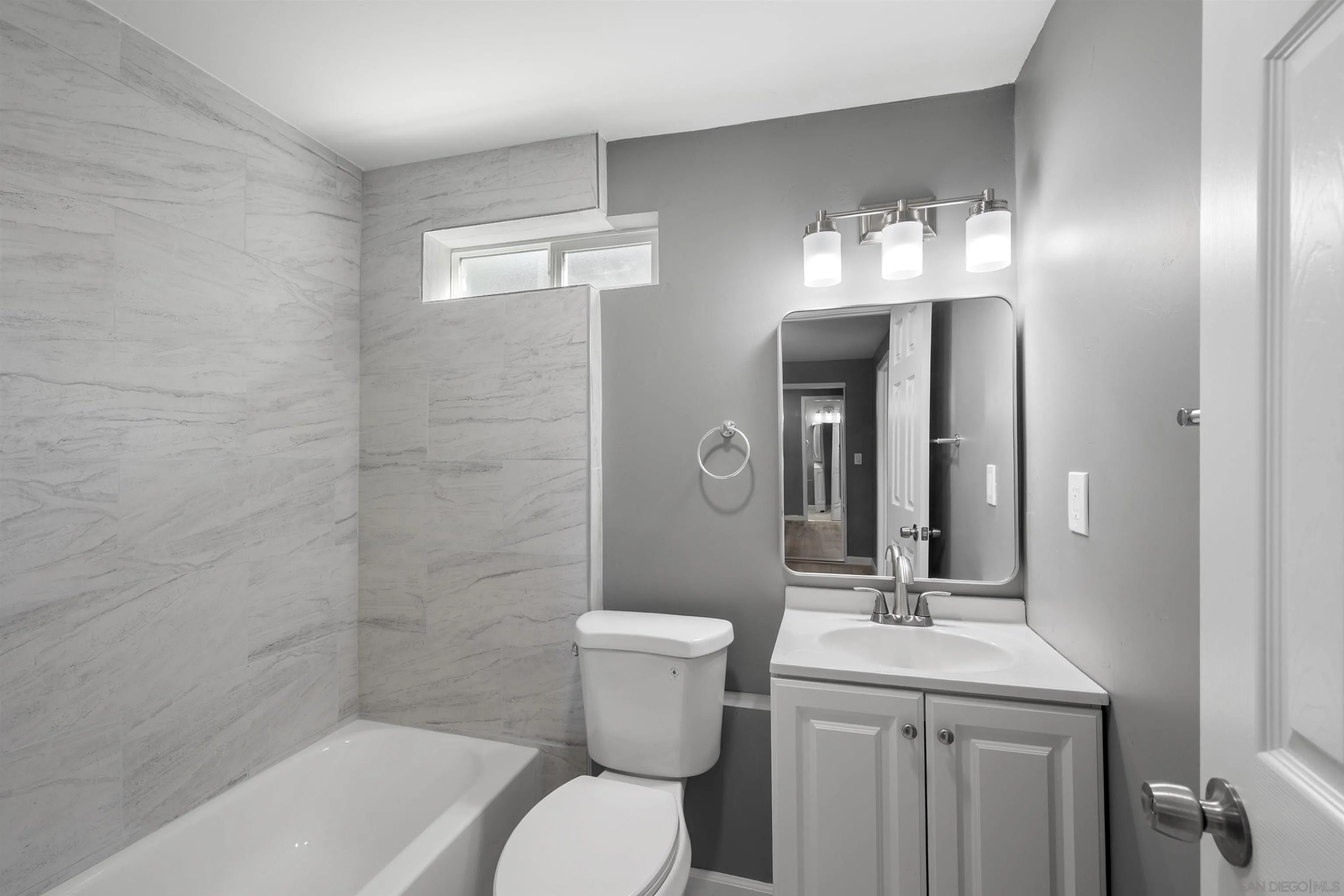 2235 Toub Street Ramona, CA 92065 - Photo 27 of 33 a bathroom with a toilet sink and mirror