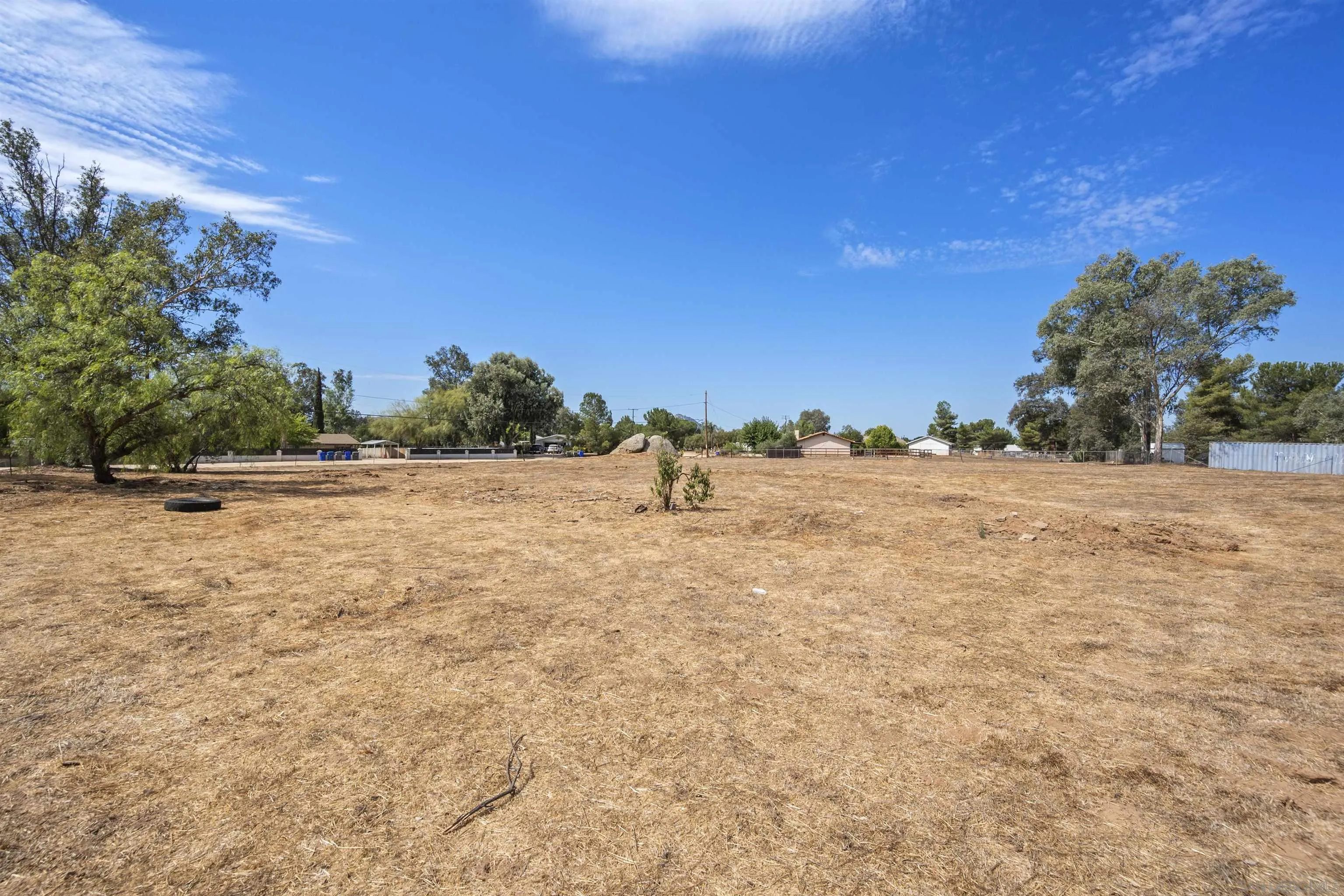 2235 Toub Street Ramona, CA 92065 - Photo 33 of 33 a backyard of a house with lots of green space and trees