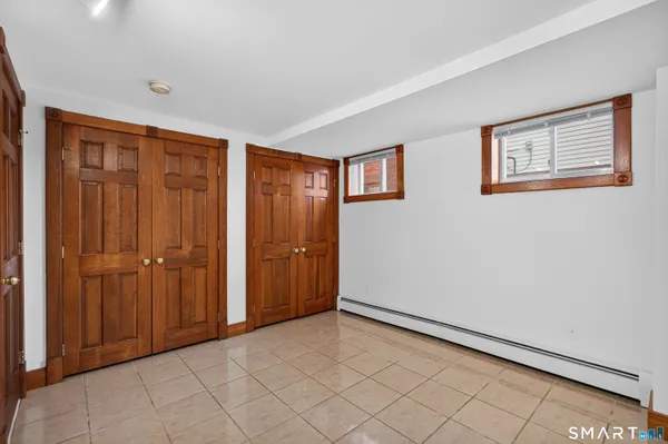 a view of an empty room and bathroom