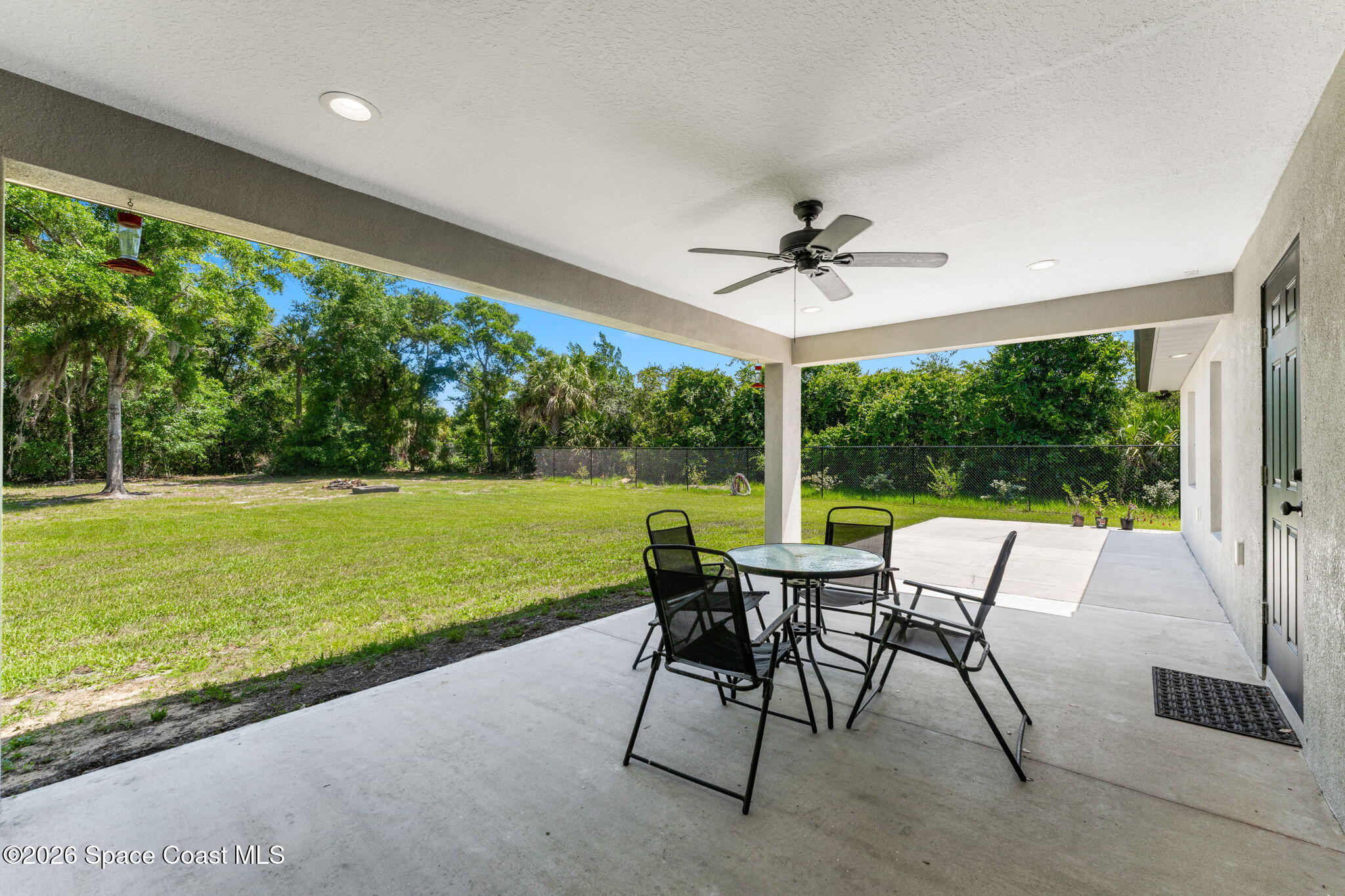3760 Montgomery Road Mims, FL 32754 - Photo 35 of 46 rear porch