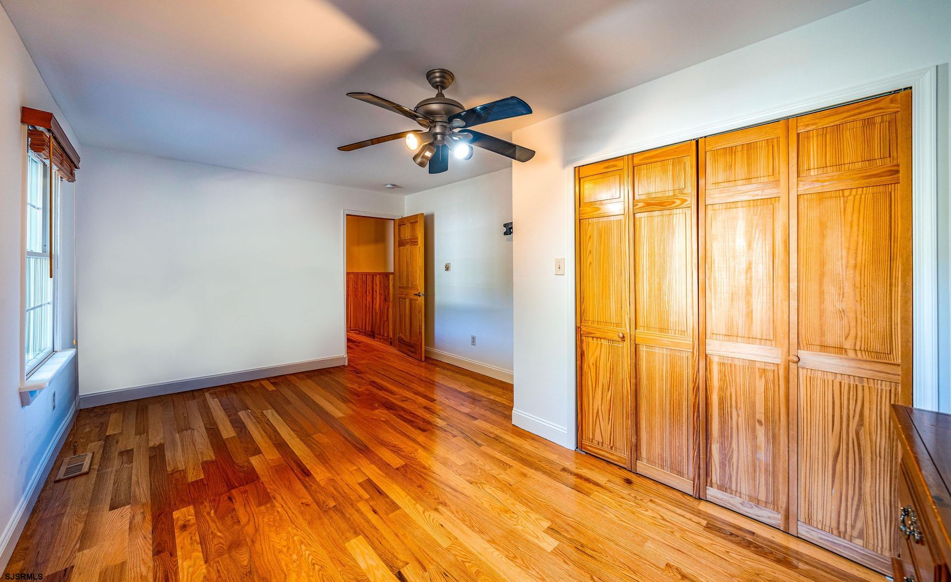 105 Tyler Road Woodbine, NJ 08270 - Photo 20 of 51 wooden floor in an empty room with a window