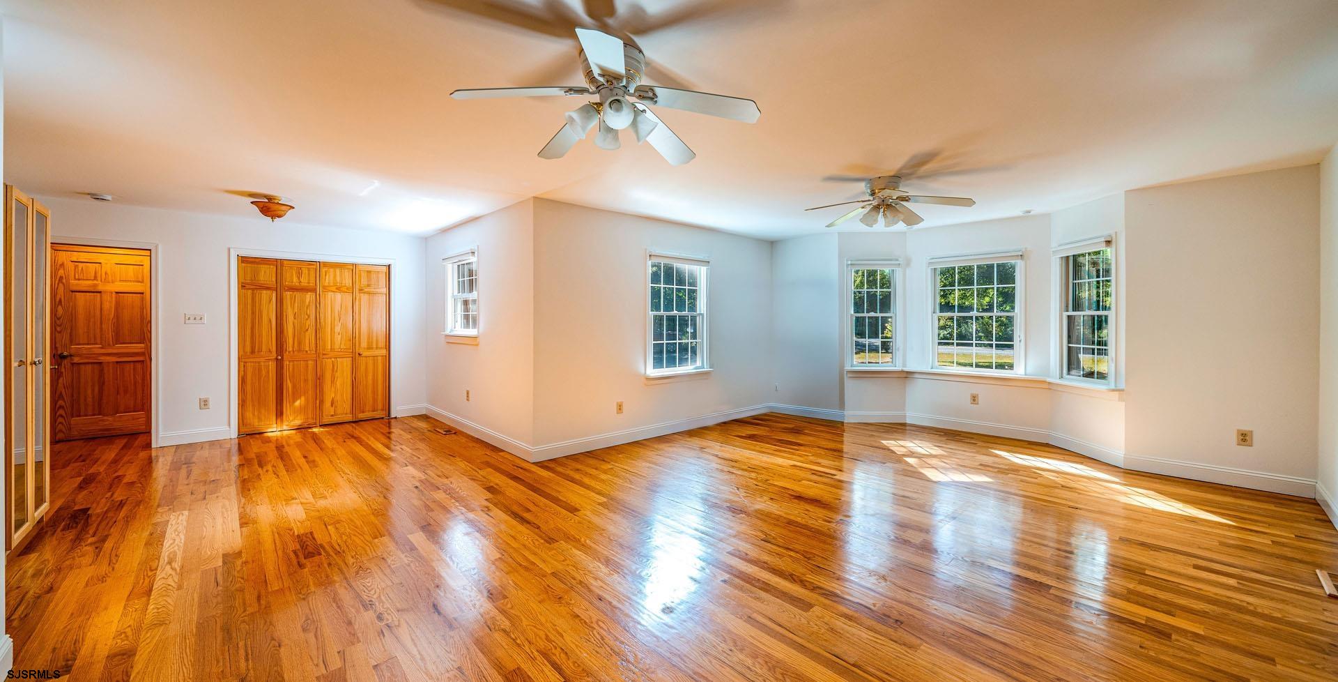 105 Tyler Road Woodbine, NJ 08270 - Photo 23 of 51 a view of an empty room with window and wooden floor