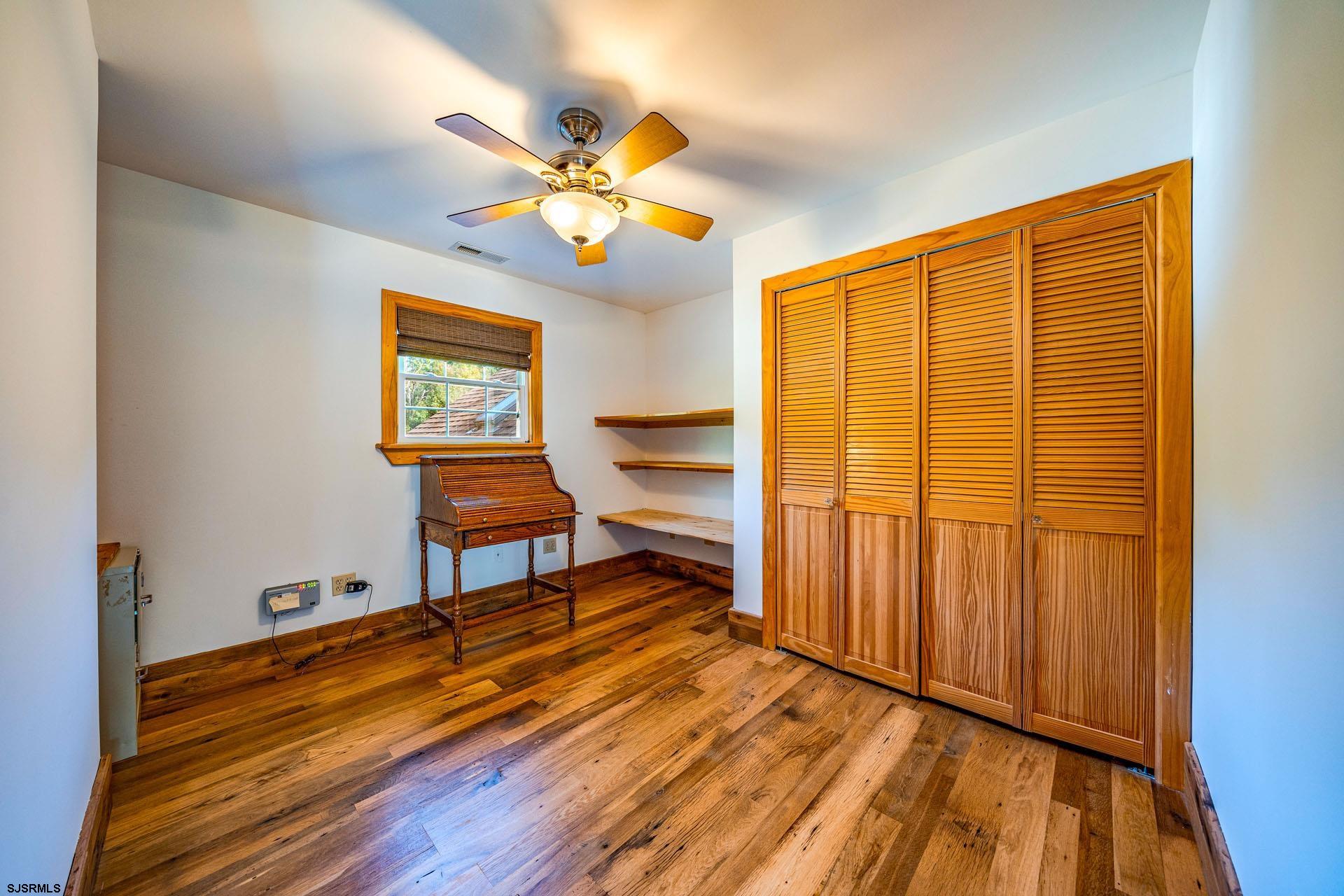 105 Tyler Road Woodbine, NJ 08270 - Photo 28 of 51 a view of room with wooden floor and fan