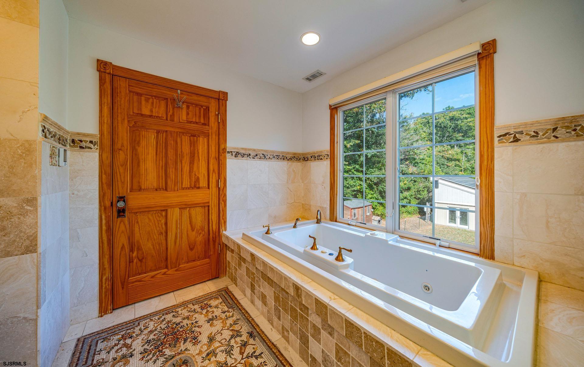 105 Tyler Road Woodbine, NJ 08270 - Photo 31 of 51 a bathroom with a bathtub and a window