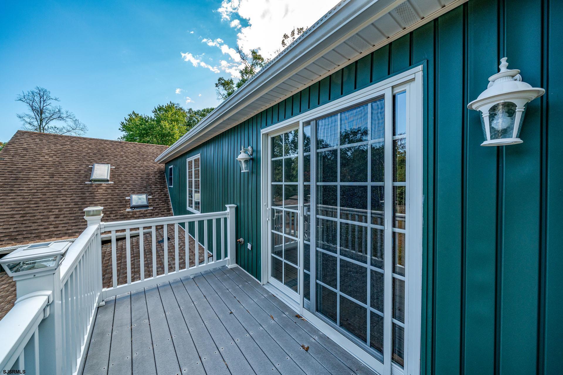 105 Tyler Road Woodbine, NJ 08270 - Photo 39 of 51 a view of front door deck with potted plants