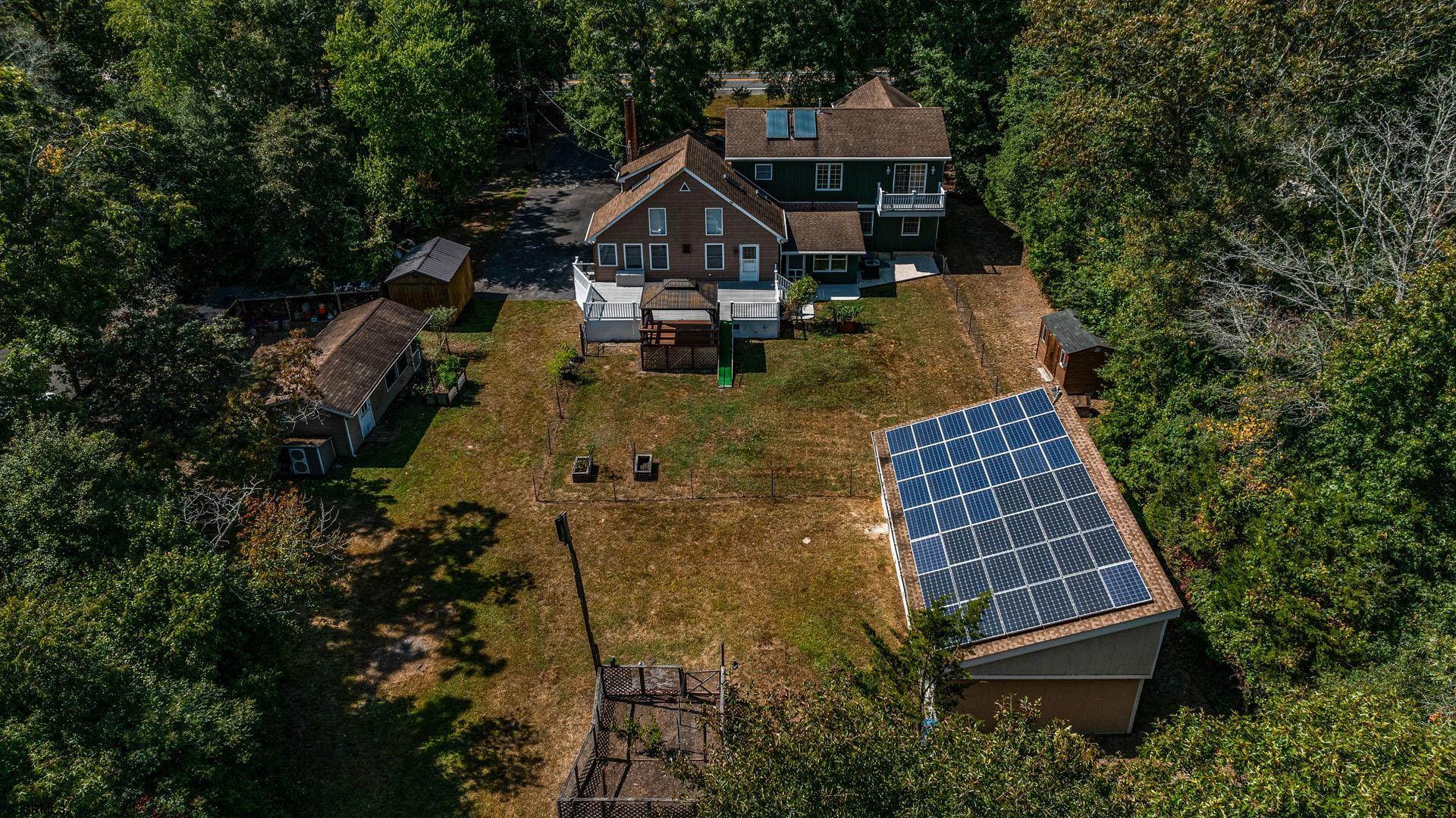 105 Tyler Road Woodbine, NJ 08270 - Photo 43 of 51 an aerial view of a house with swimming pool and trees