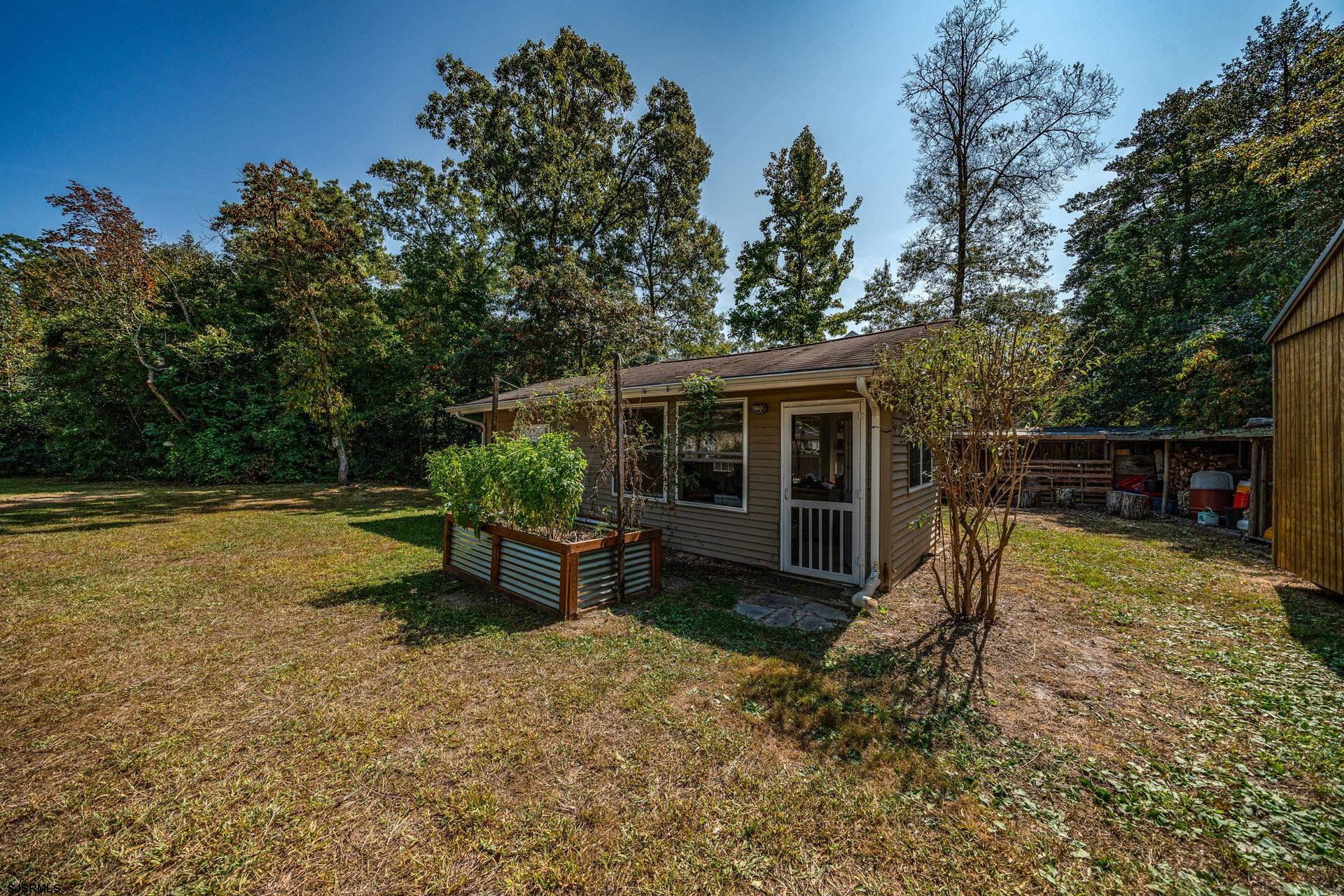 105 Tyler Road Woodbine, NJ 08270 - Photo 49 of 51 a view of a house with backyard and sitting area