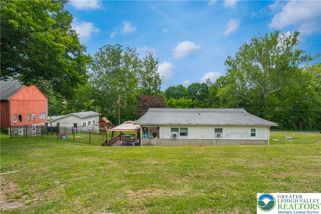 50 Kohls Road Northampton, PA 18067 - Photo 39 of 54 A spacious yard surrounds this charming home with a cozy covered deck, perfect for outdoor enjoyment.