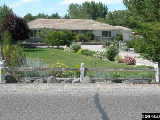 3184 Bottom Fallon, NV 89406 - Photo 1 of 1 a view of a garden with a fountain