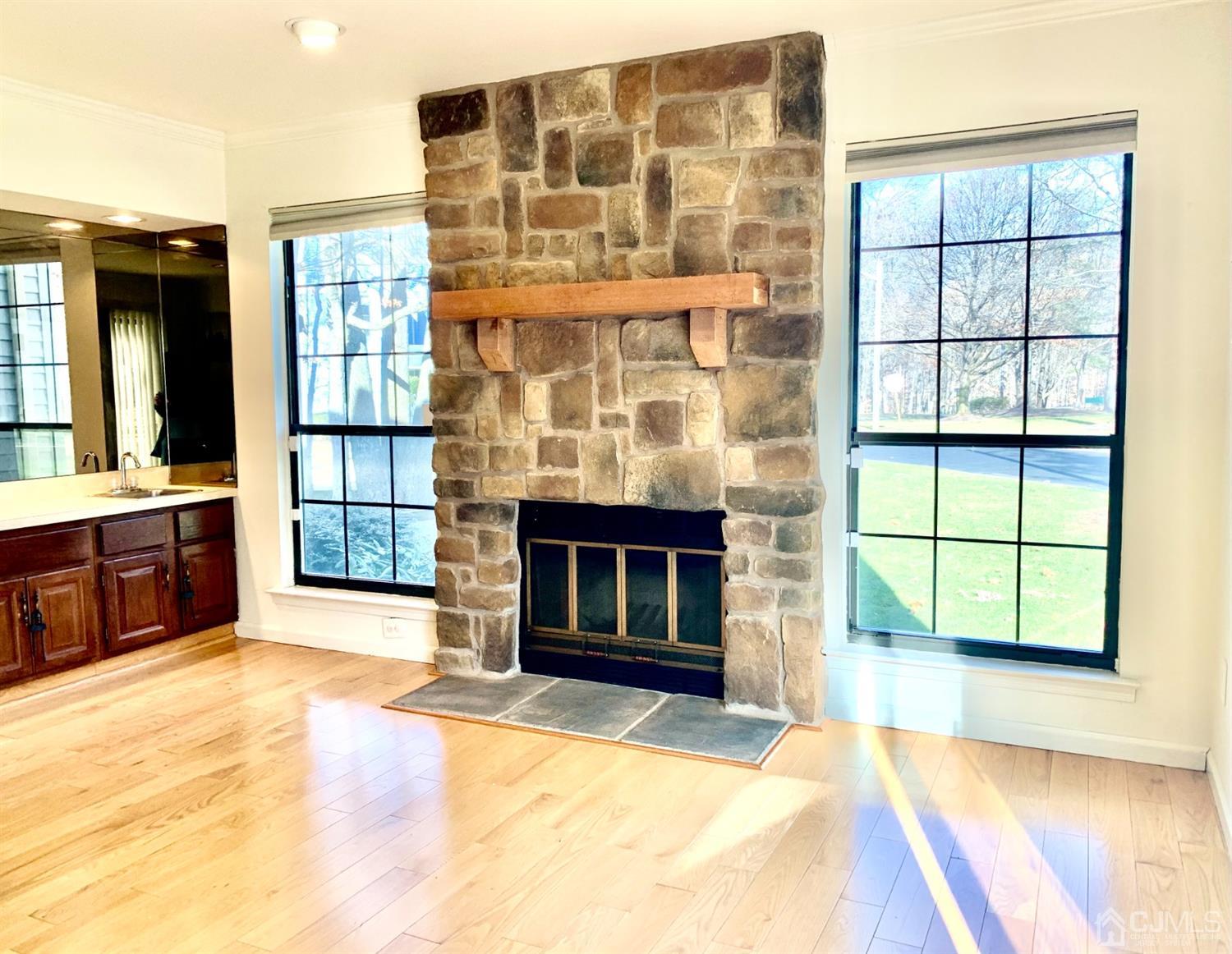 1001 Timber Oaks Road, Unit 1001 Edison, NJ 08820 - Photo 19 of 25 a view of an empty room with a fireplace and a window