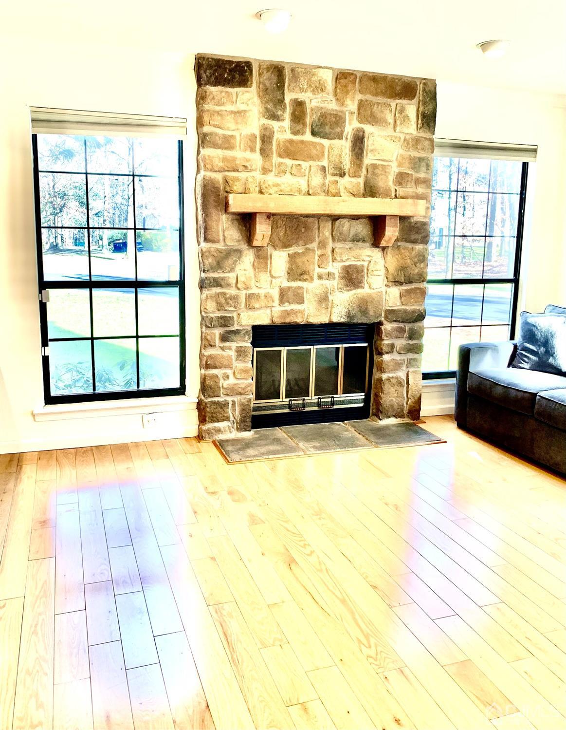 1001 Timber Oaks Road, Unit 1001 Edison, NJ 08820 - Photo 20 of 25 a view of an empty room with a fireplace and a window