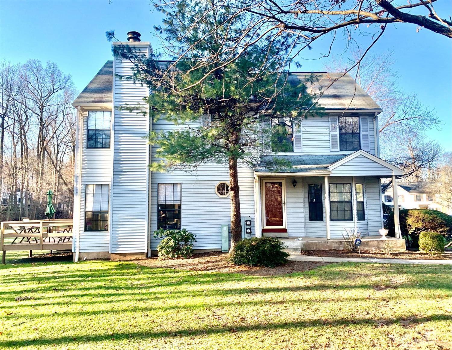 1001 Timber Oaks Road, Unit 1001 Edison, NJ 08820 - Photo 3 of 25 a front view of a house with a garden