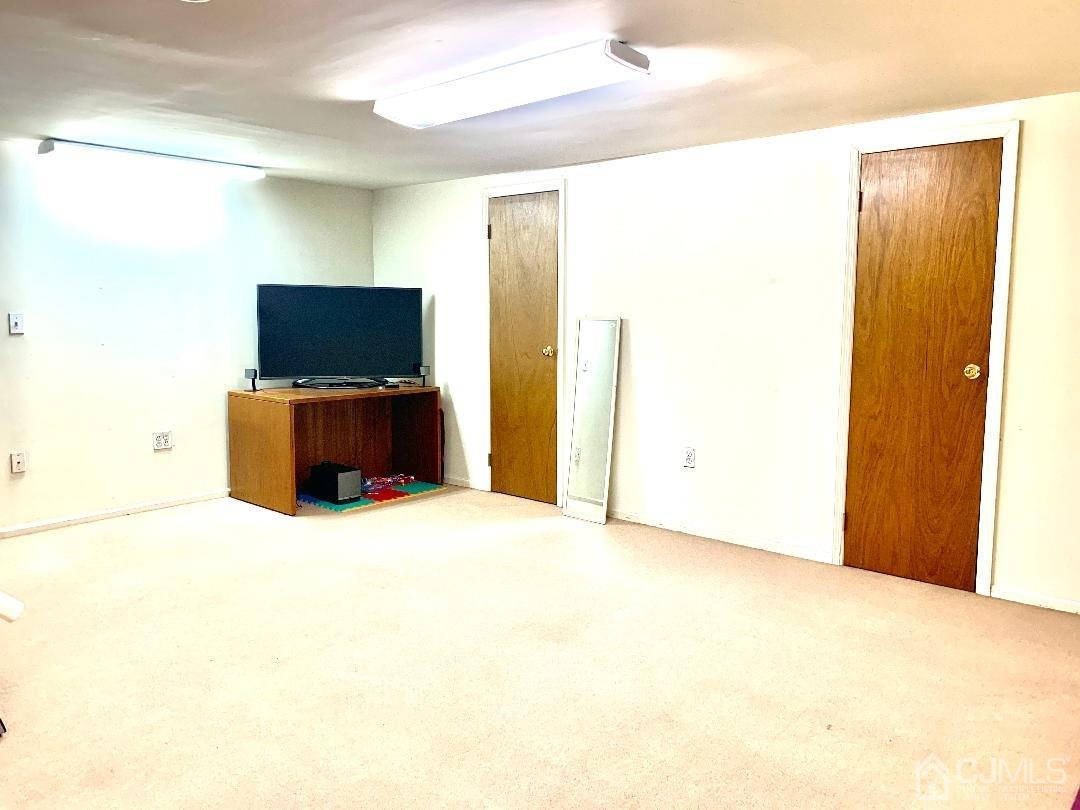 1001 Timber Oaks Road, Unit 1001 Edison, NJ 08820 - Photo 23 of 25 a view of workspace with flat screen tv